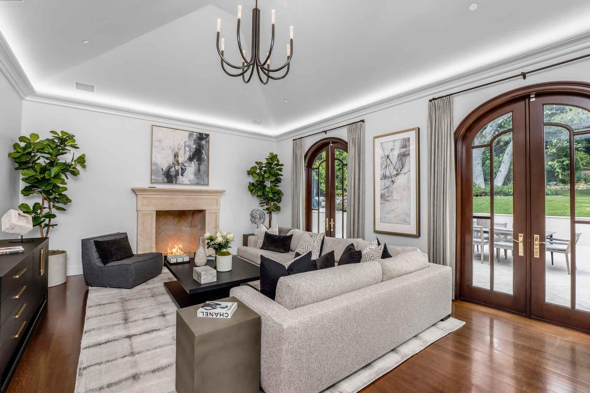 2084 East Valley Road, Unit SHARE 1 Santa Barbara, CA 93108 - Photo 12 of 35 a living room with furniture chandelier and a fireplace