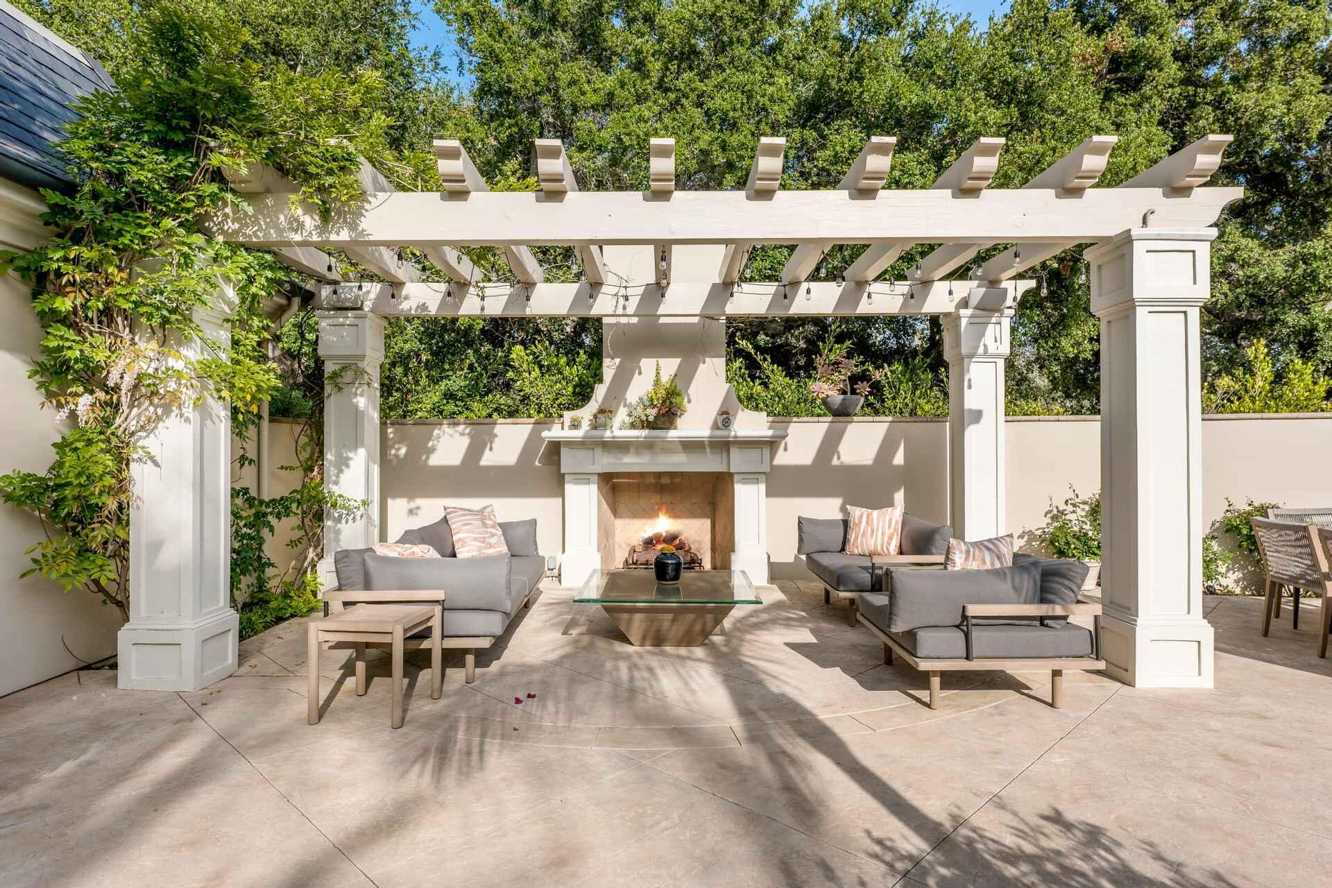 2084 East Valley Road, Unit SHARE 1 Santa Barbara, CA 93108 - Photo 29 of 35 a view of a patio with table and chairs and potted plants