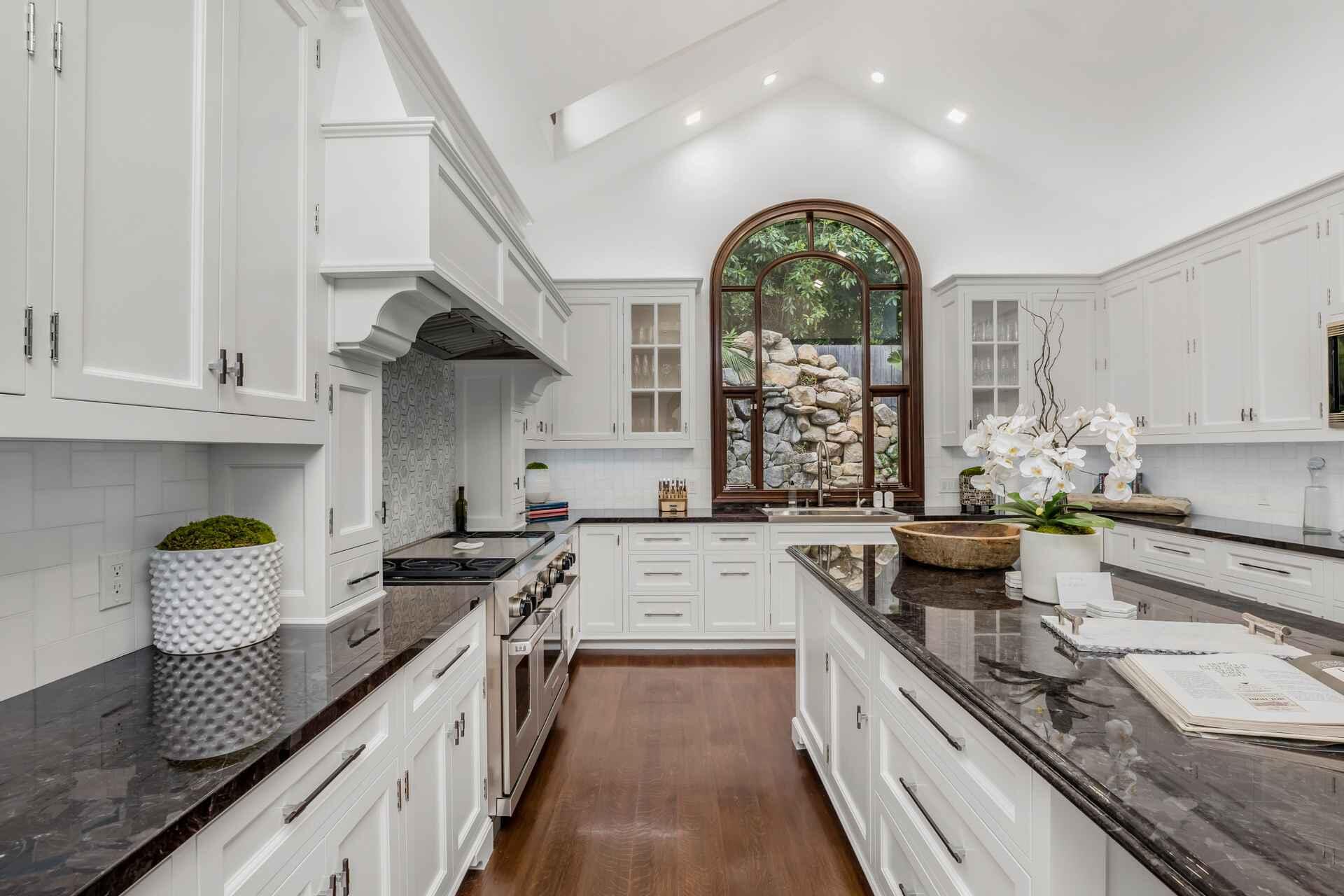 2084 East Valley Road, Unit SHARE 1 Santa Barbara, CA 93108 - Photo 4 of 35 a kitchen with stainless steel appliances granite countertop a stove and cabinets