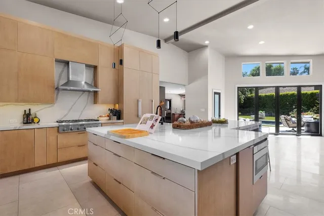 a view of a living room and floor to ceiling window