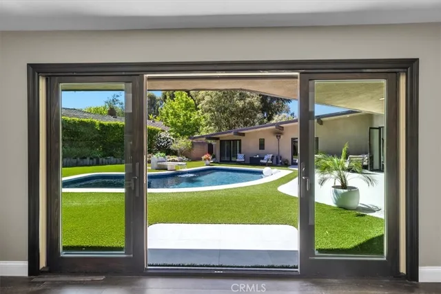 a living room with fireplace furniture and a flat screen tv