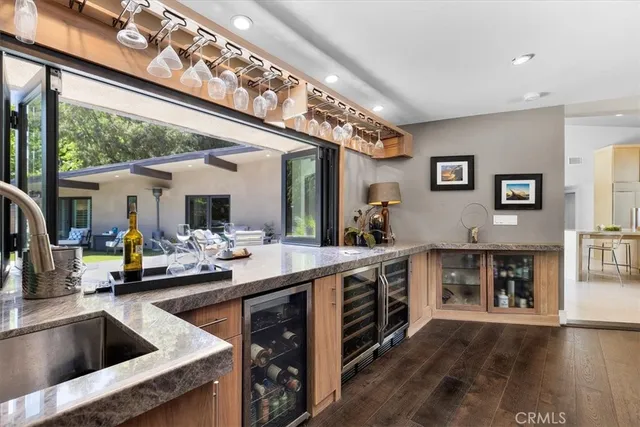 a spacious bedroom with a bed and a large mirror