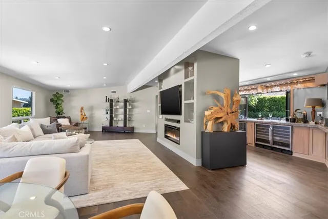 a bathroom with a granite countertop sink a mirror and shower