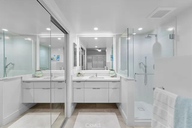 a bedroom with a large bed and a large window