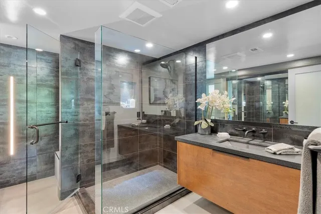 a bedroom with a large bed and a large window