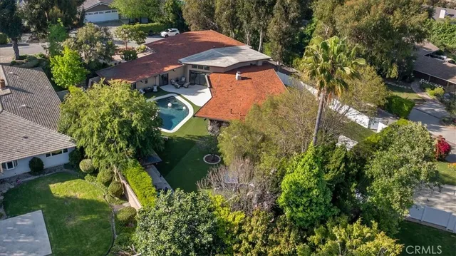 an aerial view of garden with swimming pool