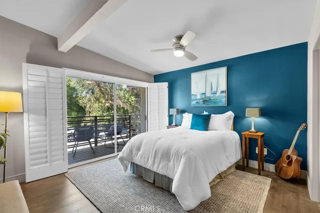 a large bedroom with a large bed and a large window