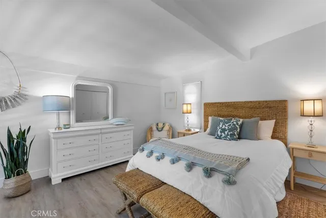 a bedroom with a large bed and a large window