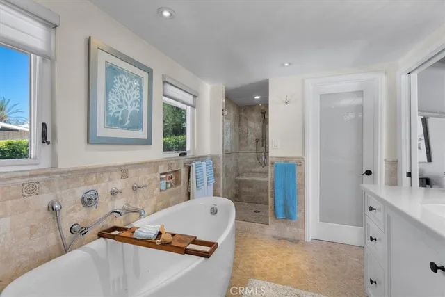 a view of a house with backyard swimming and sitting area