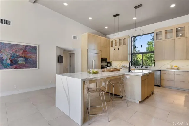 a kitchen with a stove and cabinets