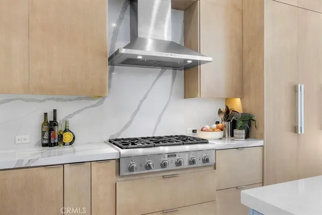 a kitchen with sink and refrigerator