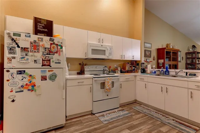 a white refrigerator freezer sitting inside of a kitchen