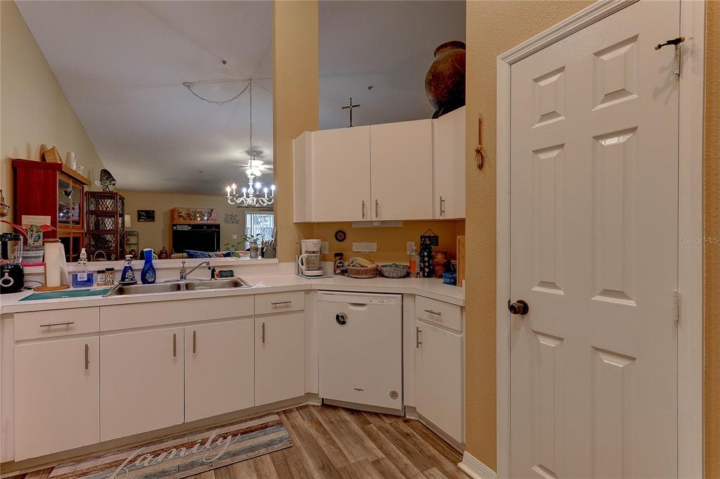 8405 Terrace Meadows Court, Unit 8405 Temple Terrace, FL 33637 - Photo 13 of 28 a kitchen with white cabinets and sink