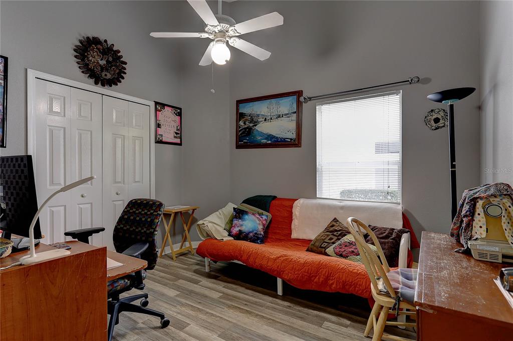 8405 Terrace Meadows Court, Unit 8405 Temple Terrace, FL 33637 - Photo 20 of 28 a bedroom with furniture and a window