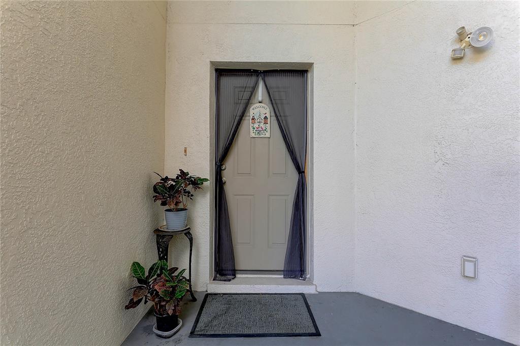 8405 Terrace Meadows Court, Unit 8405 Temple Terrace, FL 33637 - Photo 5 of 28 a view of a hallway with a flower pot