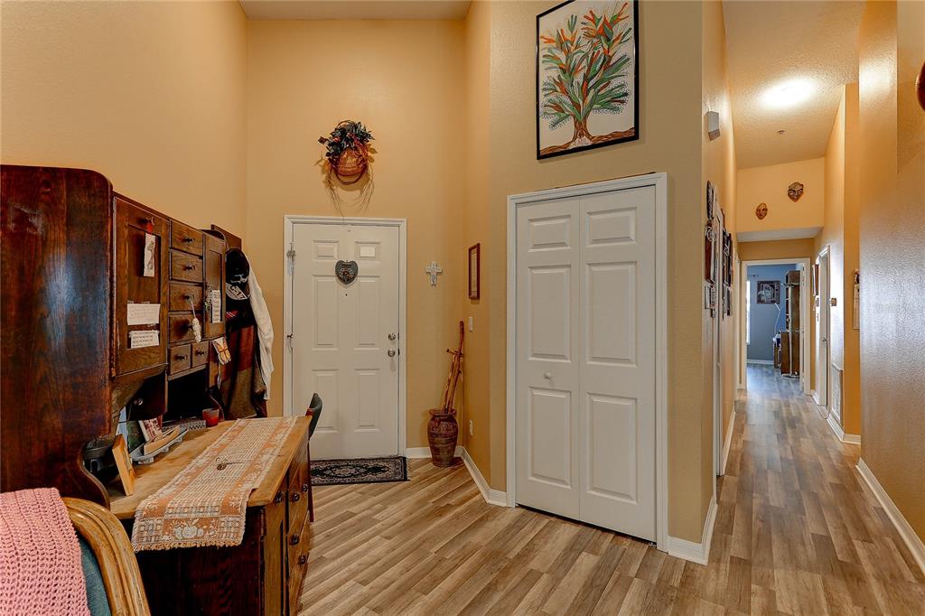 8405 Terrace Meadows Court, Unit 8405 Temple Terrace, FL 33637 - Photo 6 of 28 a view of a hallway with wooden floor and closet