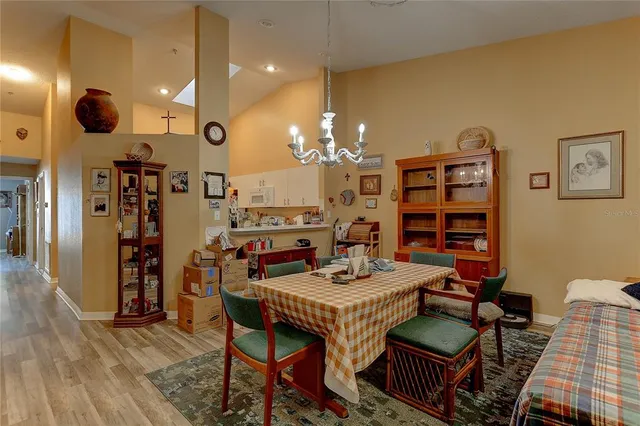 a dining room with furniture and wooden floor