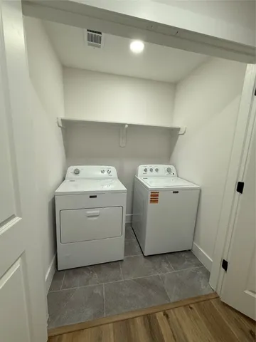 a utility room with dryer and washer