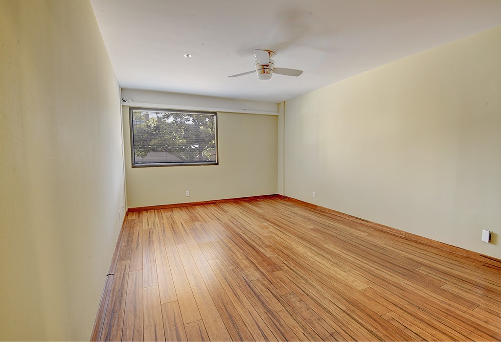 40 North Interstate Highway 35, Unit 2C2 Austin, TX 78701 - Photo 13 of 35 wooden floor in an empty room with a window
