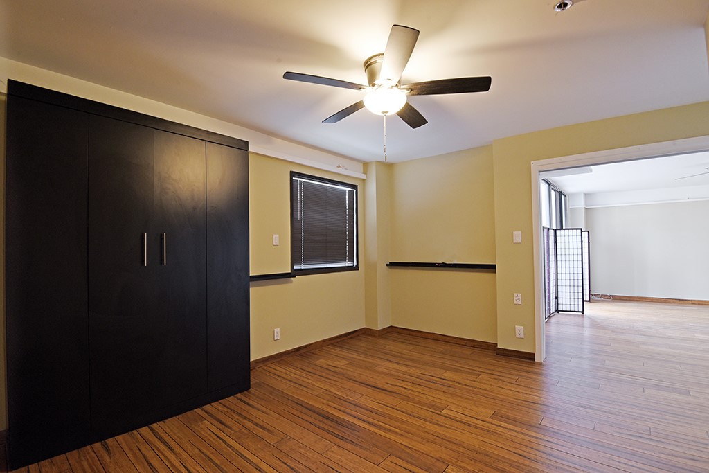 40 North Interstate Highway 35, Unit 2C2 Austin, TX 78701 - Photo 18 of 35 a view of an empty room with wooden floor