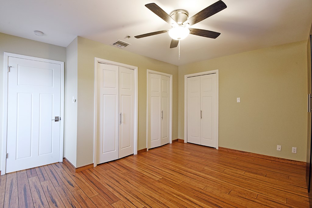 40 North Interstate Highway 35, Unit 2C2 Austin, TX 78701 - Photo 20 of 35 an empty room with wooden floor and windows
