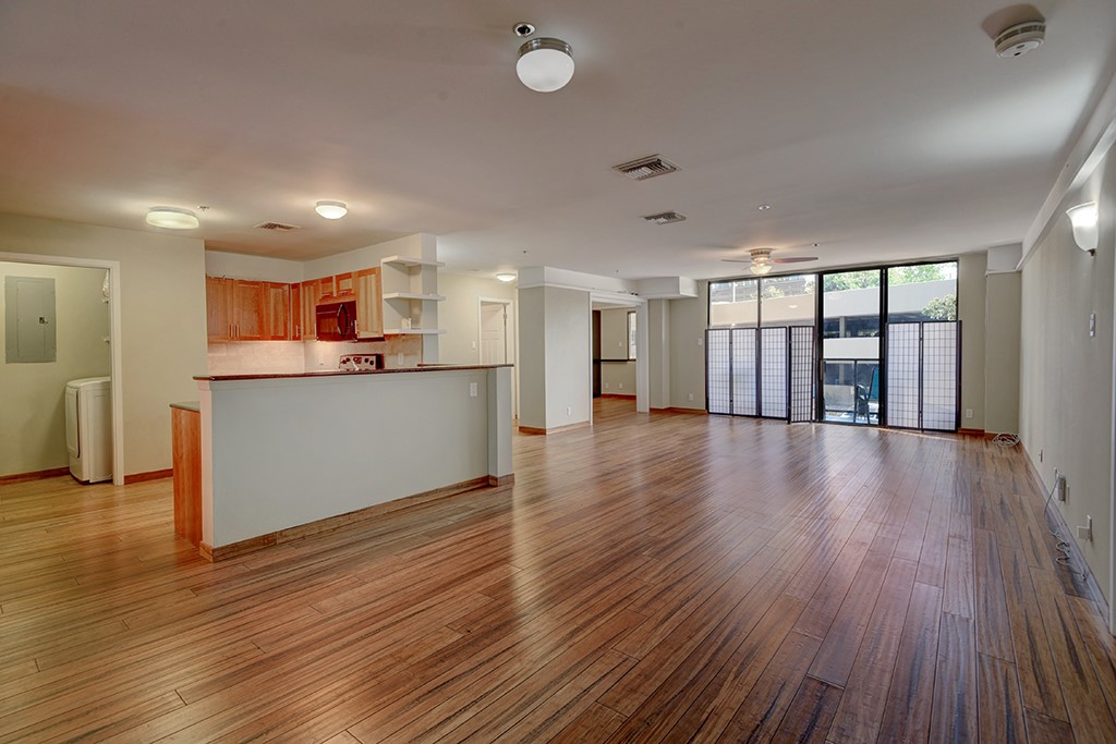 40 North Interstate Highway 35, Unit 2C2 Austin, TX 78701 - Photo 5 of 35 a view of a kitchen with a dishwasher and a large window