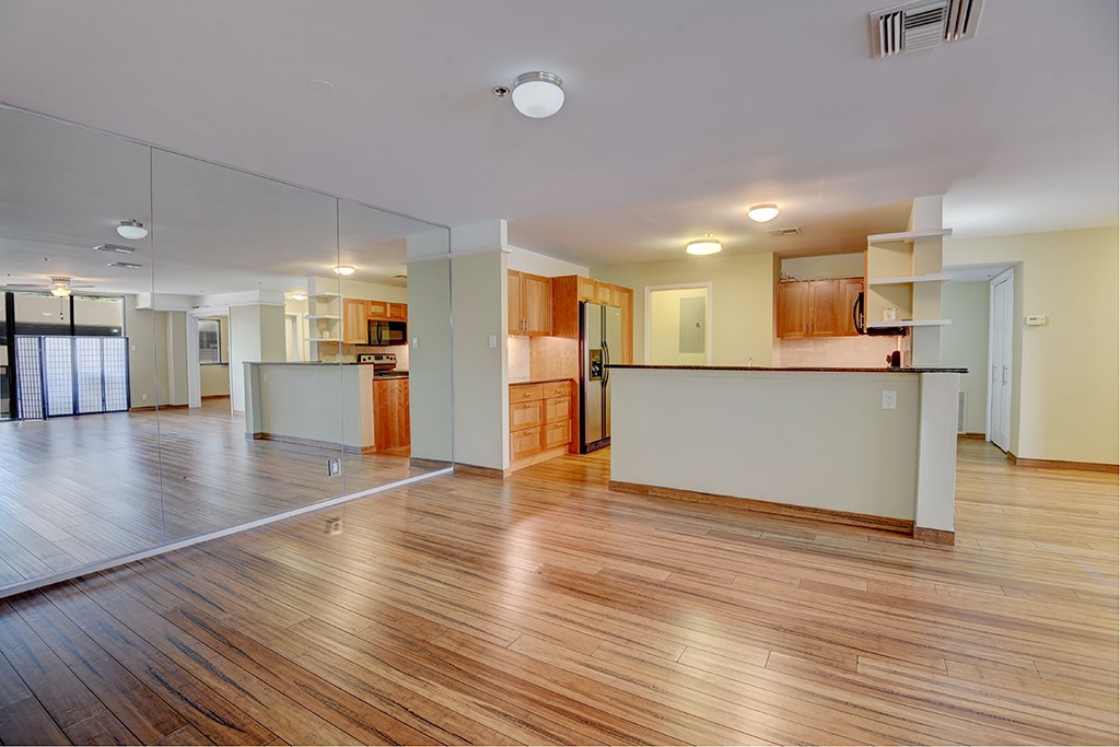 40 North Interstate Highway 35, Unit 2C2 Austin, TX 78701 - Photo 6 of 35 a view of a kitchen with a wooden floor and a kitchen