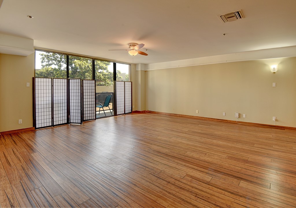 40 North Interstate Highway 35, Unit 2C2 Austin, TX 78701 - Photo 8 of 35 a view of an empty room with wooden floor and a window