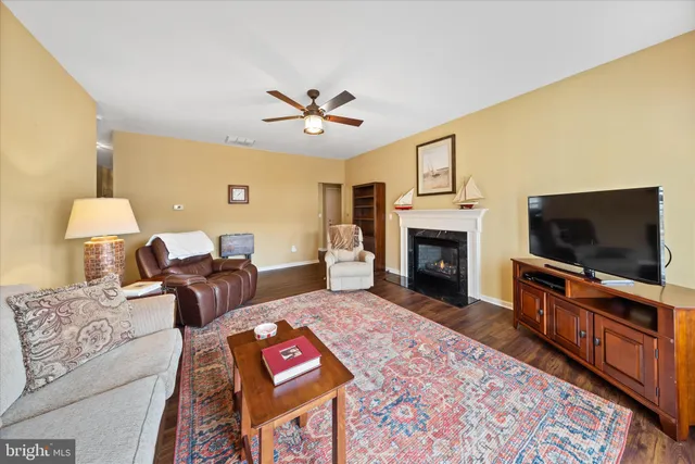 a view of a balcony with wooden floor and outdoor seating