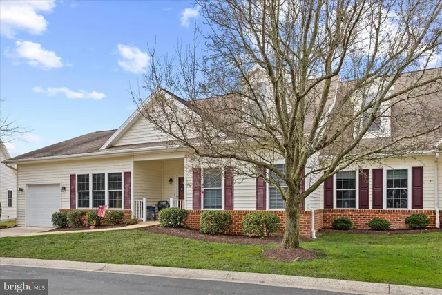 a kitchen with stainless steel appliances granite countertop a sink a stove and a microwave