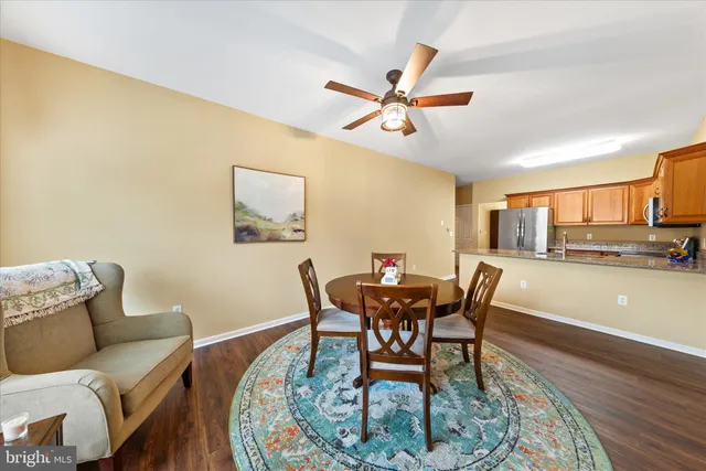 a kitchen with stainless steel appliances granite countertop a stove microwave and sink
