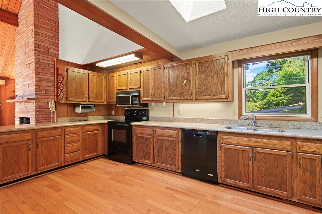 171 Jenny Lane Boone, NC 28607 - Photo 17 of 50 a kitchen with stainless steel appliances granite countertop a stove a sink dishwasher and a refrigerator