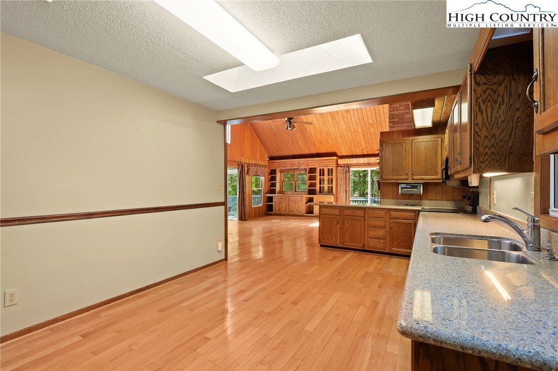 171 Jenny Lane Boone, NC 28607 - Photo 19 of 50 a kitchen with stainless steel appliances granite countertop a stove a sink and a refrigerator