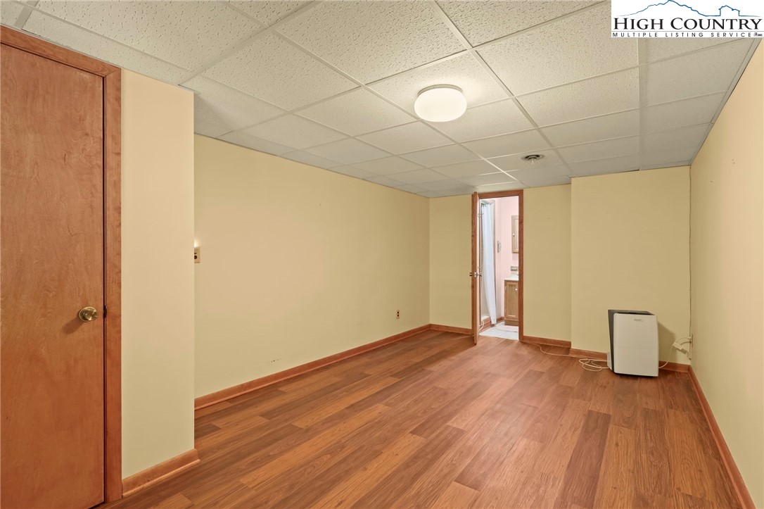 171 Jenny Lane Boone, NC 28607 - Photo 40 of 50 a view of an empty room with wooden floor