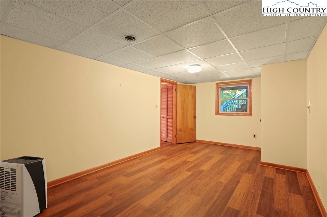 171 Jenny Lane Boone, NC 28607 - Photo 41 of 50 a view of an empty room with wooden floor