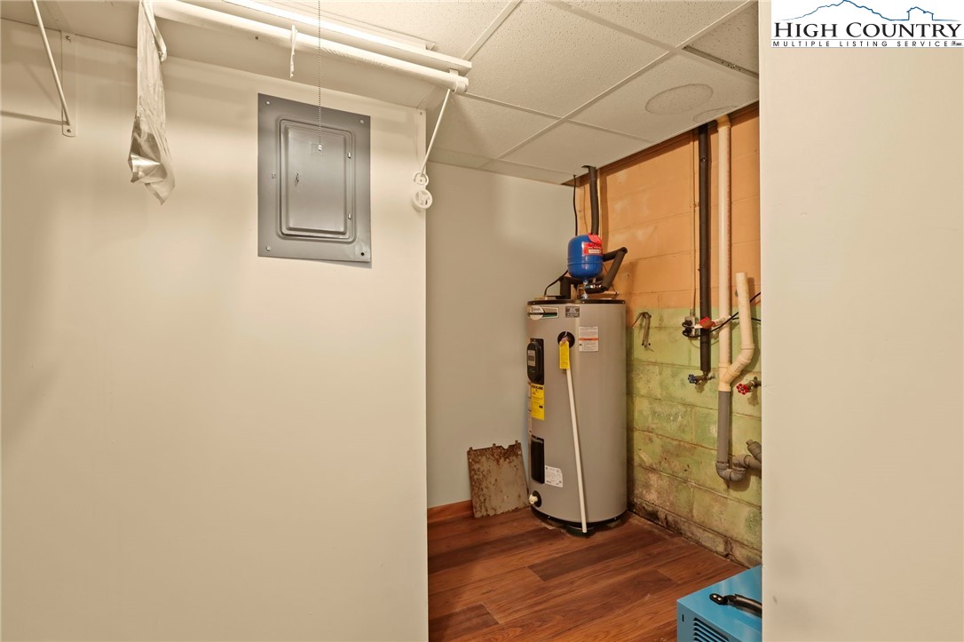 171 Jenny Lane Boone, NC 28607 - Photo 44 of 50 a view of a hallway with wooden floor and closet