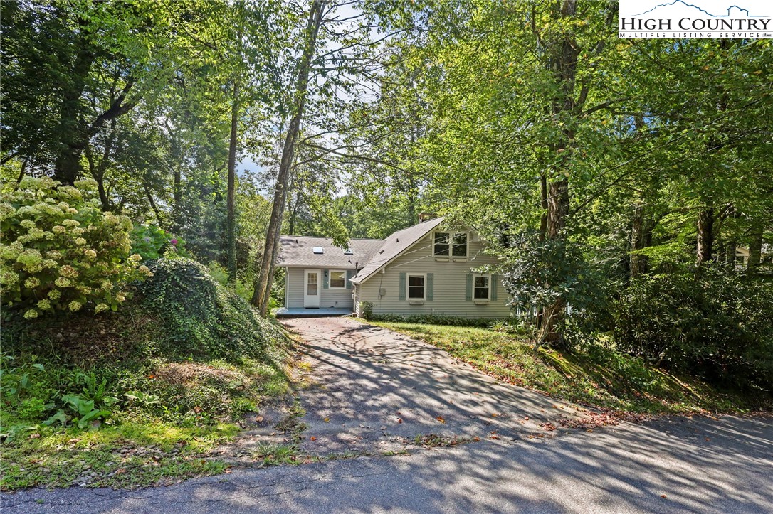 171 Jenny Lane Boone, NC 28607 - Photo 50 of 50 a view of a house with a small yard and large tree