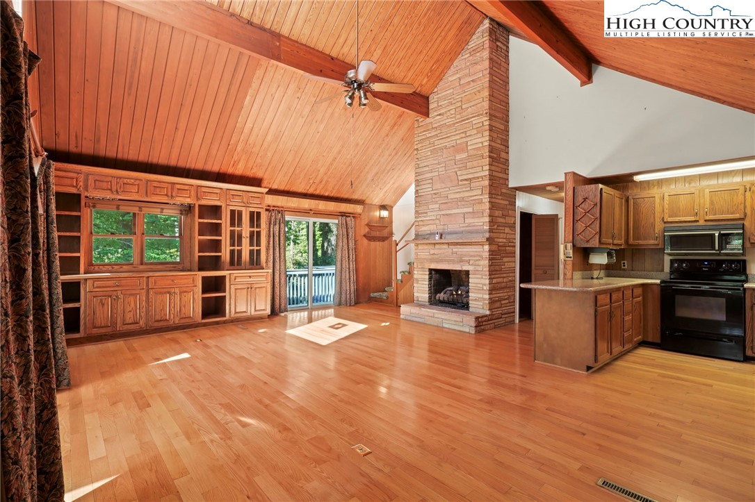 171 Jenny Lane Boone, NC 28607 - Photo 7 of 50 a view of a house with a barbeque and wooden roof