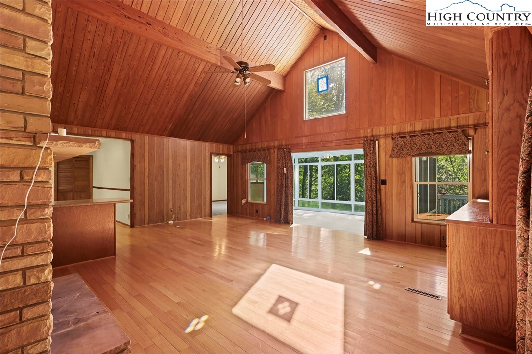 171 Jenny Lane Boone, NC 28607 - Photo 9 of 50 a view of a patio with table and chairs and wooden floor