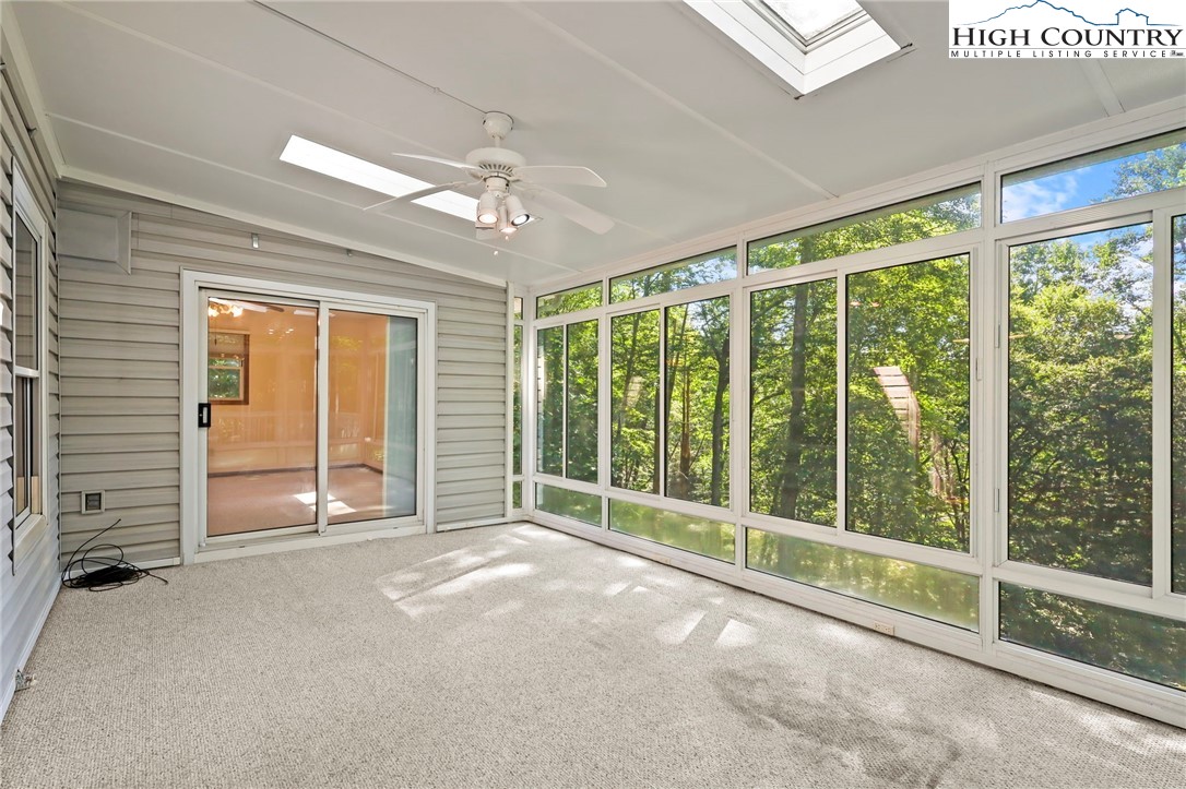 171 Jenny Lane Boone, NC 28607 - Photo 10 of 50 a view of empty room with floor to ceiling window