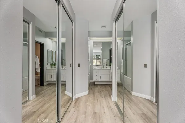 a bathroom with a granite countertop sink a shower and a mirror