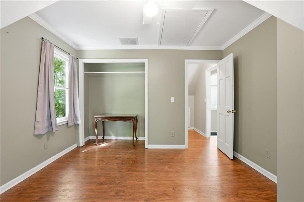 3259 Etchison Road Loganville, GA 30052 - Photo 24 of 50 a view of an empty room with wooden floor and a window