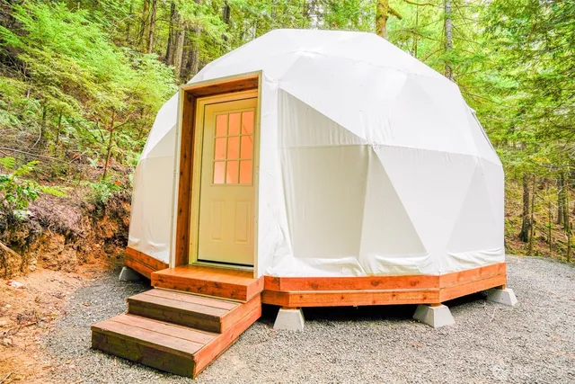 a view of backyard with swimming pool