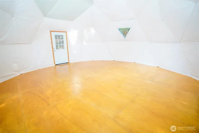 a view of a big room with windows