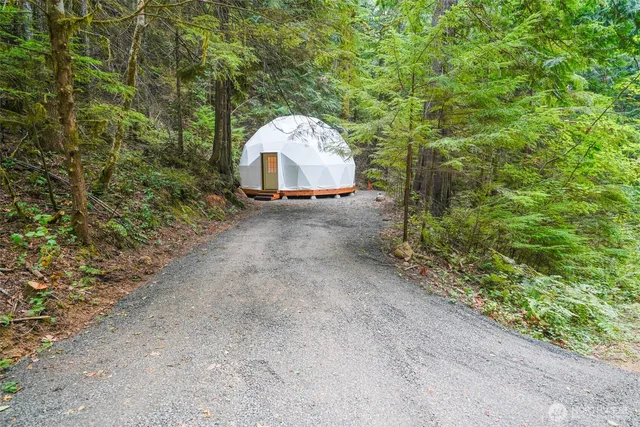 a view of a small pool with a yard