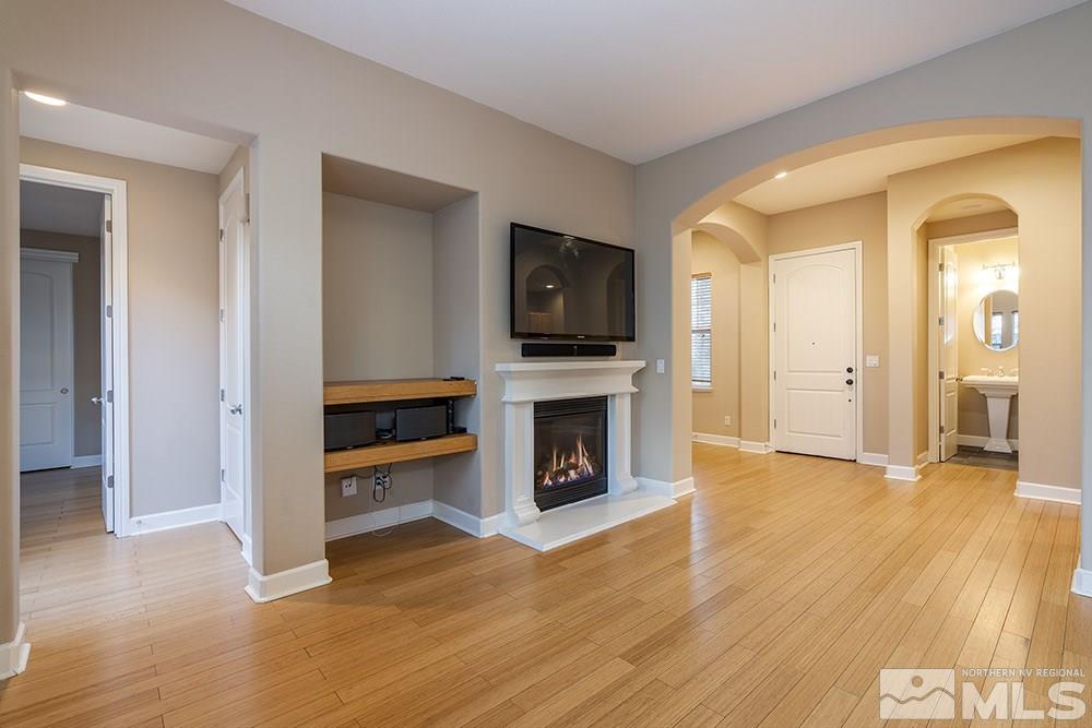1672 Sawtooth Trail Reno, NV 89523 - Photo 3 of 25 wooden floor fireplace and windows in an empty room