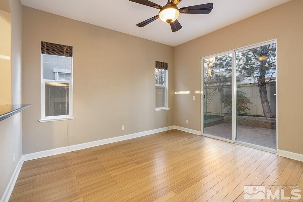 1672 Sawtooth Trail Reno, NV 89523 - Photo 4 of 25 an empty room with wooden floor fan and windows