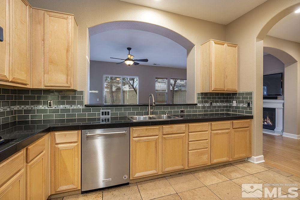 1672 Sawtooth Trail Reno, NV 89523 - Photo 9 of 25 a kitchen with stainless steel appliances granite countertop a sink a stove and cabinets