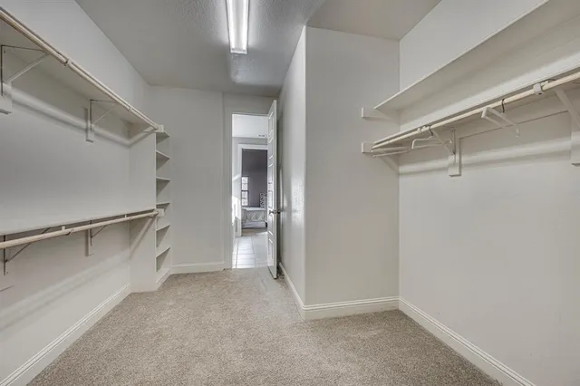 a view of an empty walk in closet