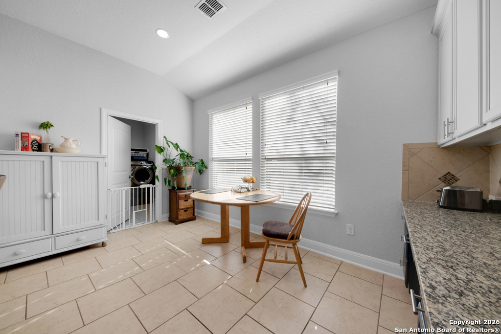 400 Bison Lane Cibolo, TX 78108 - Photo 14 of 34 a view of a dining room with furniture and a window